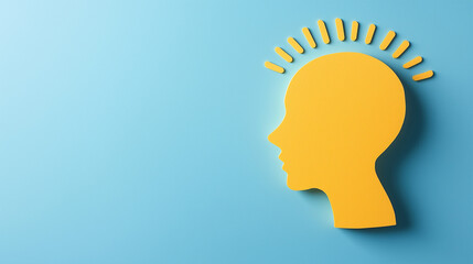 A vivid yellow profile silhouette symbolizes mental wellness and psychological health, set against a calming blue backdrop, promoting mindfulness concepts, copy space