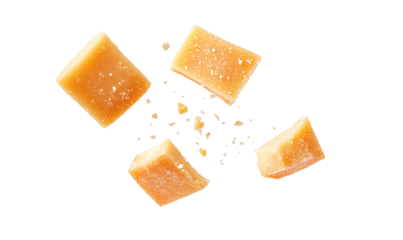 Slices of Parmesan cheese falling on transparent background