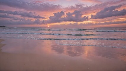Obraz premium Pastel Sunset Reflections: Soft Waves Gently Rolling onto the Beach as the Sky Paints a Beautiful Array of Pink and Purple Hues