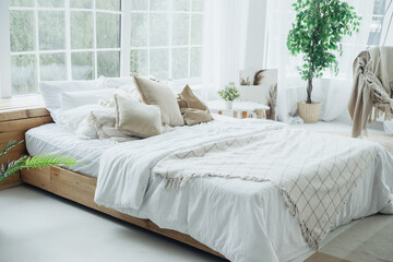 Cozy bedroom with natural light and soft textiles creating a serene atmosphere in the morning