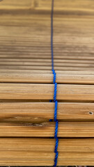 Woven bamboo is called "kere" in Indonesia, being rolled up to divide a room or block sunlight or rain outdoors.
