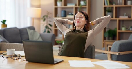 Home, woman and relax with laptop at desk for remote work, research and done with freelance project. Happy, journalist and smile with documents by technology for success in editing of online article