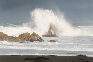 Waves Heavily Crashing on Coastal Rocks - Dramatic Seaside Action