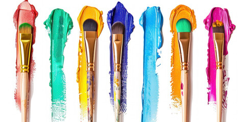 Paint brushes of various sizes and colors neatly arranged in a row on a white background ? stock photo.