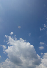 
Blue sky and puffy clouds