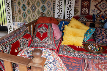 cushions and carpet are made of traditional textiles.
