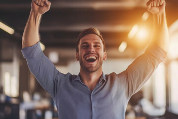 Fototapeta premium Portrait of a man expressing a joyful celebration of success, with arms raised in triumph, in an office background, with copy space. Bright, motivational lighting. Professional workspace background.