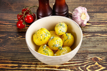 Boiled potato with oil and dill