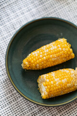 Boiled corn with salt, healthy eating.