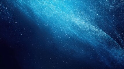 Fototapeta premium A glowing blue gradient transitions smoothly across a grainy, textured surface, creating a futuristic vibe on a dark, noisy background,