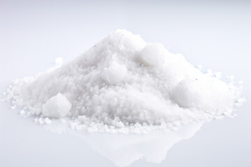 Fine grains of salt sprinkled neatly on a bright white background, forming a soft, delicate texture.