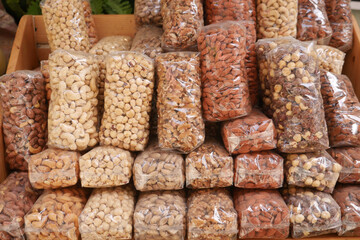 many mixed nuts in a plastic packet on shelf 