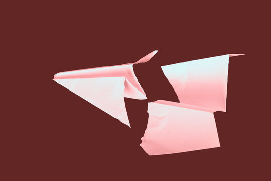 paper plane in the middle it is torn. concept of breakdown, accident, crash, does not work. close-up.