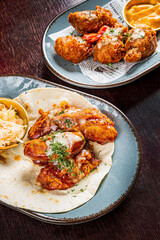 chicken wings with sauce and salad