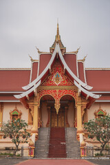 A beautiful gate entrance of temple palace that locate in the south of Wat Phra That Luang in Vientiane, Laos