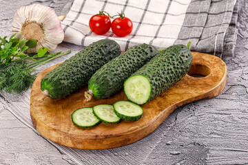 Raw green cucumbers with slices
