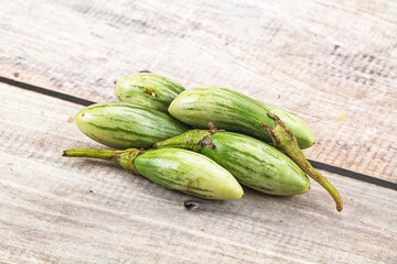 Small organic young green eggplant