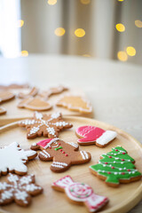 Christmas homemade gingerbread cookies on wooden table.