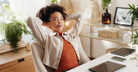 Break, relax and woman in home office resting with complete project, report or work deadline. Calm,...