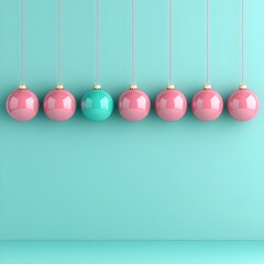 Colorful Christmas ornaments hanging against a turquoise background