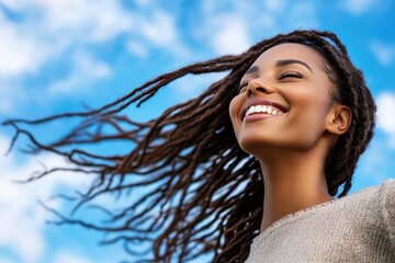 Radiant smile, young woman enjoying sunny day with blue sky