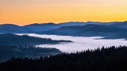 Fototapeta premium Serene landscape at dawn with misty valleys and rolling hills under a colorful sky.