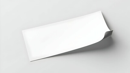 Blank White Paper Curls Up On One Edge