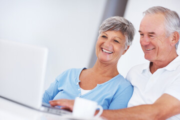 Elderly woman, man and laptop with coffee, smile and morning with reading, search and email in...