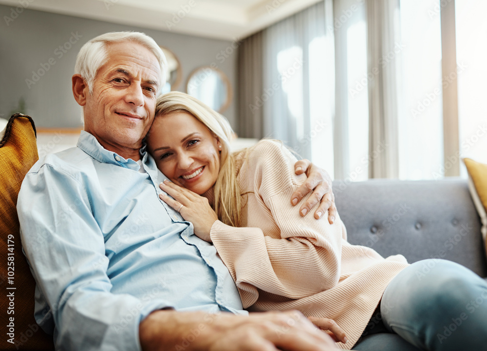 Poster Portrait, smile and mature couple hug for love, healthy relationship and loyalty to partner in home. Face, happy man and woman embrace together for connection, support or trust on sofa in living room