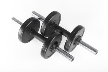 Fototapeta premium Sport and fitness - Pair dumbbells with two weights in white