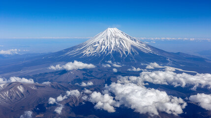 Aerial View of Snow-Capped Mountain Surrounded by White Clouds, Majestic Winter Landscape Panorama.
