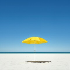 Fototapeta premium a yellow umbrella on a beach