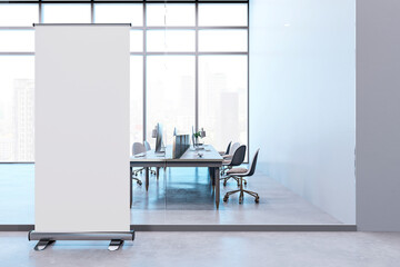 Modern office interior with a blank roll-up banner. 3D Rendering