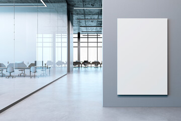 Modern office interior with empty workspace and blank canvas on wall. 3D Rendering