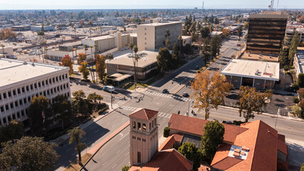 Bakersfield, California, USA - November 24, 2023: Afternoon sun shines on a historic church and urban core of downtown Bakersfield.