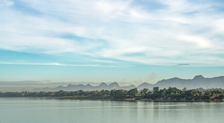 sky, river, mountains, bright sunlight