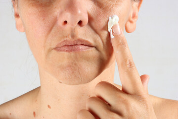 Fototapeta premium close-up on the wrinkles around the mouth of a 45-year-old woman , nasolabial folds