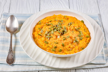 butternut squash puree with pumpkin seeds in bowl