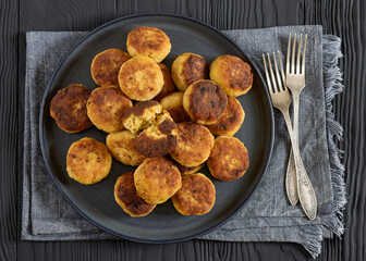 Northern Pike fish cakes on dark grey plate