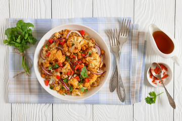cauliflower chickpea quinoa salad in a white bowl