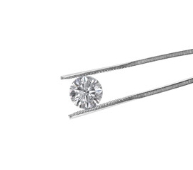 Cut Beautiful diamond held by tweezers, transparent background
