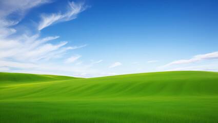 Fototapeta premium Serene Landscape of Rolling Green Hills Under a Clear Blue Sky with Soft White Clouds, Evoking Tranquility and Natural Beauty in a Peaceful Setting