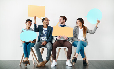 Happy, business people and waiting room with speech bubble for social media or review on a white studio background. Young, group or employees with smile, sign or shape for comment, feedback or mockup