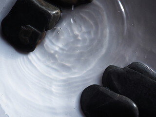 Stones in the water represent calm meditation.