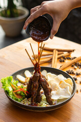sate Indonesian food with lontong