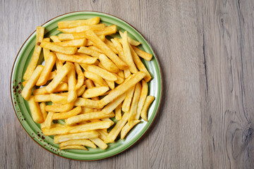 French fries served on plate on table