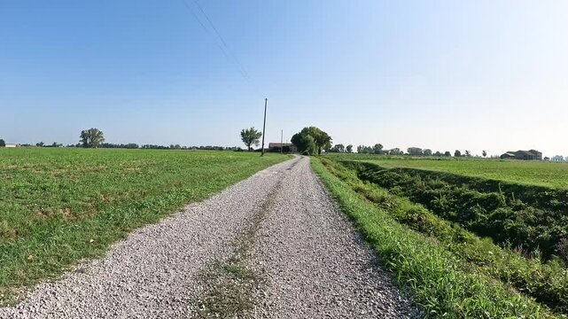 Via Francigena - a gravel road through agricultural fields near San Rocco, municipality of Busseto, province of Parma, Emilia-Romagna, Italy
