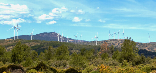 Fototapeta premium Mountains landscape. Wind turbine in mountains. Eolic park windpower. Wind farm, Wind green energy. Wind turbines, Windmill power generation in in Viver, Castellón, Caudiel, Spain.