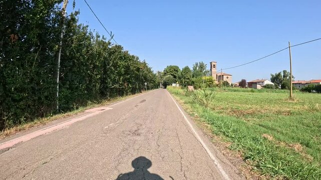 Via Francigena - a paved road entering San Rocco, municipality of Busseto, province of Parma, Emilia-Romagna, Italy
