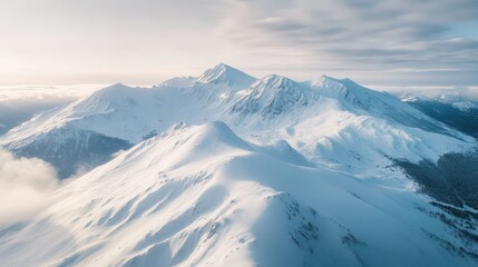 Majestic winter mountain landscape showcasing an aerial view of a snowy plateau blanketed in white